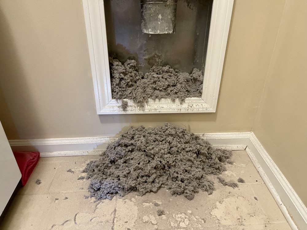 Lint fully cleared from a wall vent &mdash; SafeMom Dryer Vent Cleaning